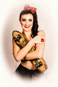 Vintage portrait of a pin-up model with skateboard