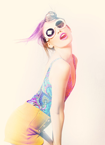 Sun flared 70s pin-up girl posing in funky colour