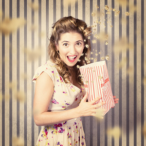 Young girl at the cinema watching halloween movie