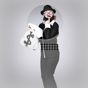 Young business person holding money at bank teller