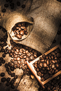 Roasted Coffee Beans In Drawer And Bags On Table