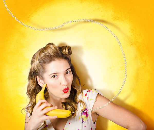 Gossiping retro pin up girl on fruit phone Print